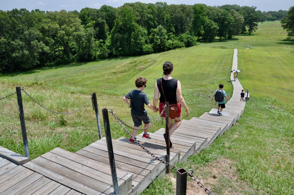 People walking down the steps at Poverty Point's Mound A.